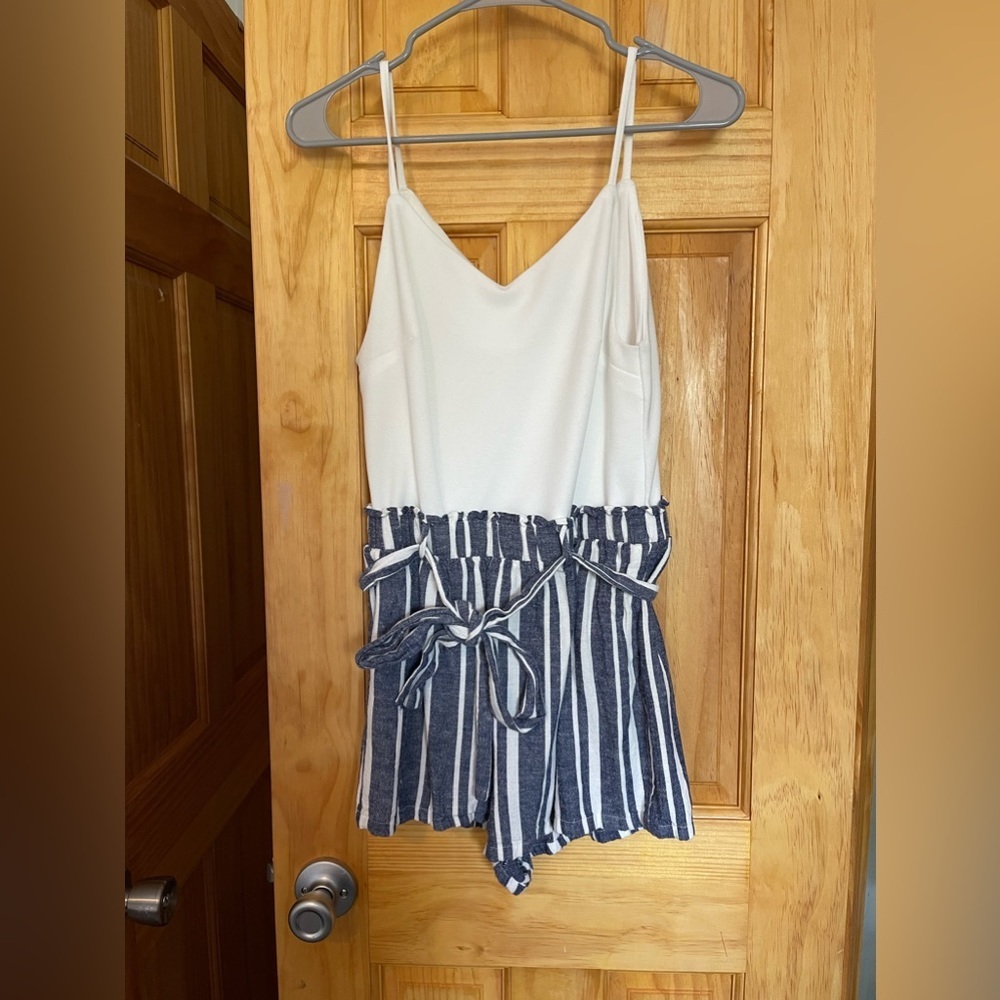 Sleeveless white romper with blue and white paper bag shorts